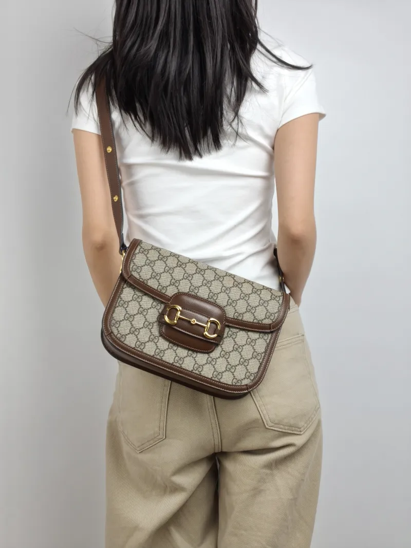 GUCCI Shoulder Bag Horsebit 1955 Horsebit Medium Monogram PVC Medium 25 × 8 × 18 cm — on-model view 2 of 3
