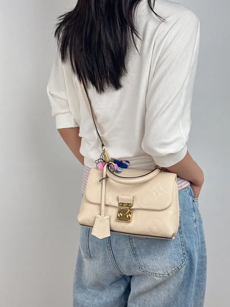 Louis Vuitton Crossbody Bag MADELEINE White Monogram Empreinte Embossed Calfskin BB 24 × 8.5 × 17 cm — on-model view 3 of 3