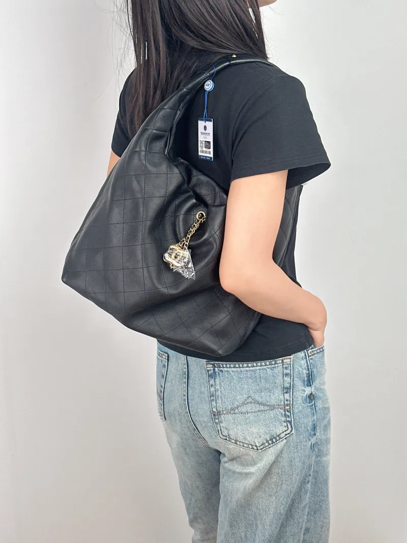 Chanel Crossbody Bag 26c hobo Black Calfskin 27.5 × 8 × 25 cm Microchip Edition — on-model view 1 of 2