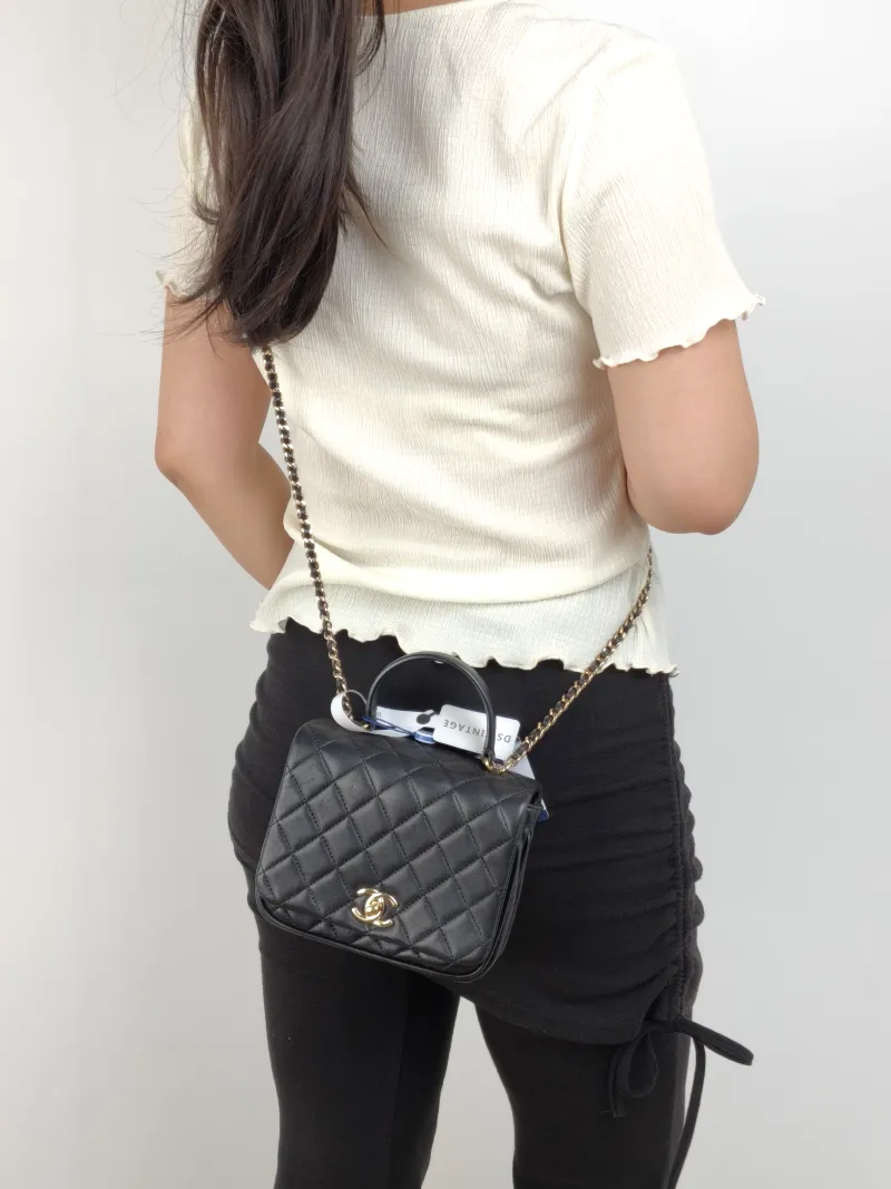 Chanel Crossbody Bag Top Handle Crossbody Bag Black Calfskin 16 × 8.5 × 13 cm 25 — on-model view 1 of 3