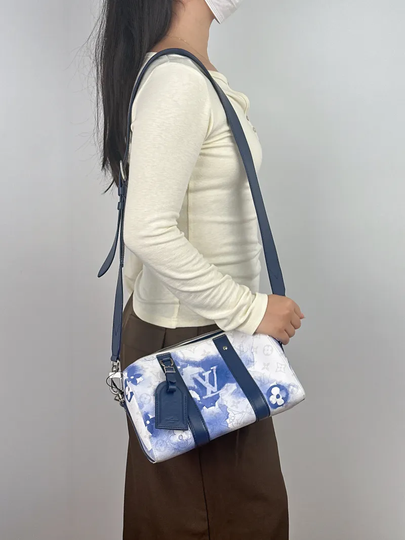 Louis Vuitton Crossbody Bag City Keepall PVC Medium 27 × 13 × 17 cm — on-model view 2 of 2