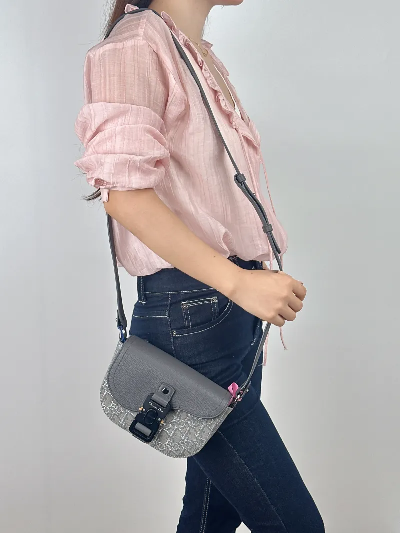 DIOR Crossbody Bag Grey Canvas Mini 20 × 5.5 × 13.5 cm — on-model view 1 of 2