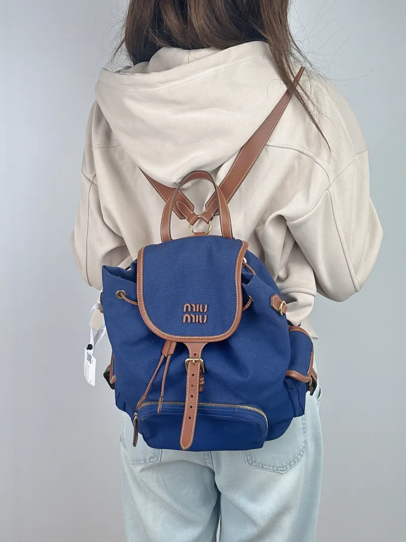 Miumiu Backpack Backpack Blue Canvas Large 25 × 12.5 × 29.5 cm — on-model view 1 of 3