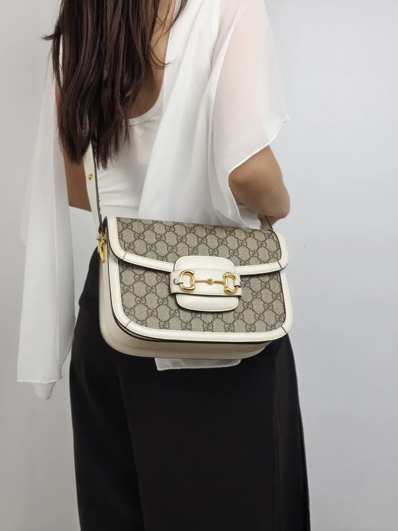GUCCI Crossbody Bag Horsebit 1955 Horsebit Medium White Monogram PVC Medium 25 × 8 × 18 cm — on-model view 1 of 2