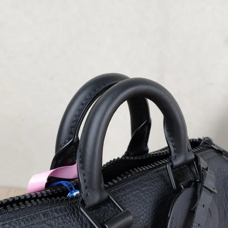 Louis Vuitton Crossbody Bag Keepall 25 Taurillon Monogram Embossed Calfskin Medium 25 × 11 × 15 cm — detail view 1 of 11