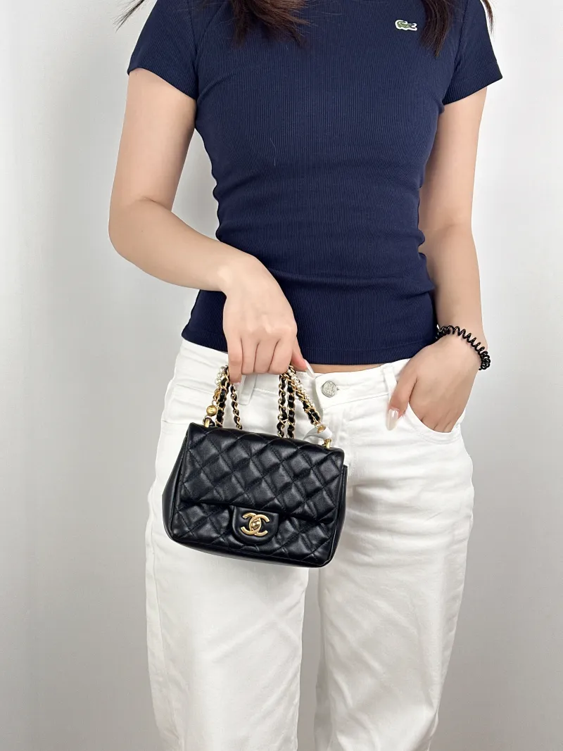 Chanel Crossbody Bag Pearl Black Lambskinmini17 × 5 × 12.5 cm — on-model view 1 of 3