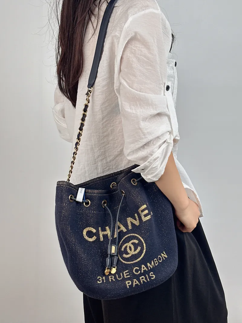 Chanel Shoulder Bag Bucket Bag Navy Gold Canvas 20 × 15 × 25 cm 28 — on-model view 2 of 2