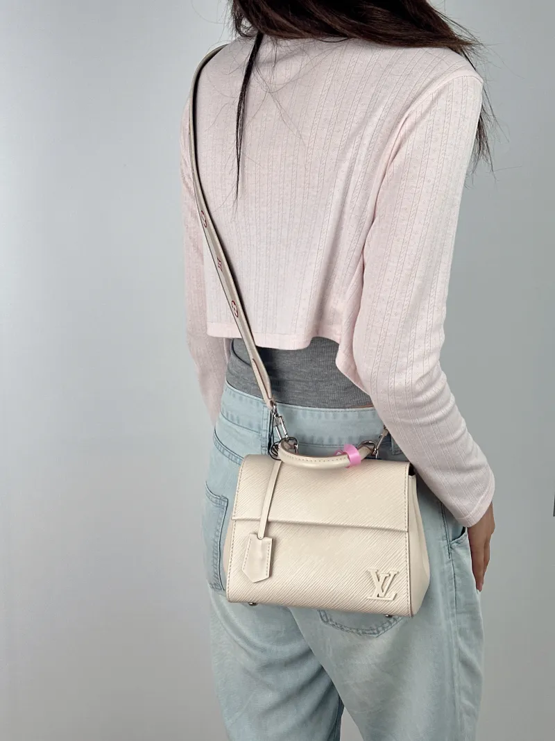 Louis Vuitton Crossbody Bag CLUNY White Epi Embossed Calfskin Mini 20 × 7.5 × 16 cm — on-model view 1 of 3