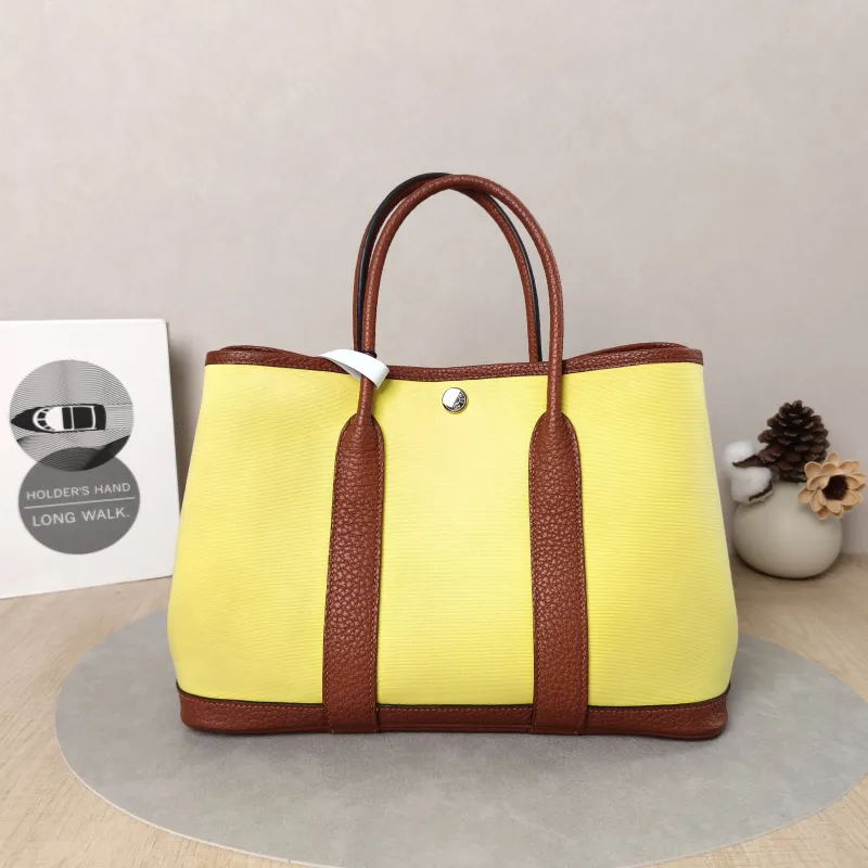 Hermès Top Handle Bag Garden Party 30 30 Canvas · Negonda Calfskin Medium30 × 13 × 21 cm