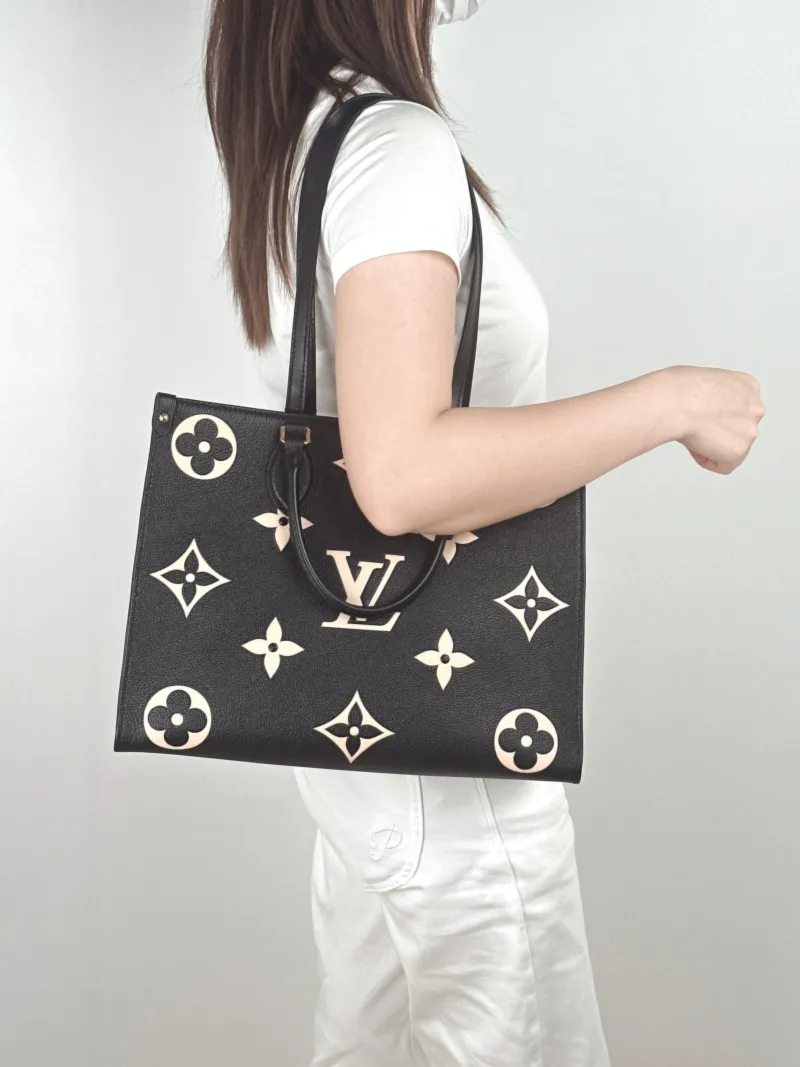Louis Vuitton Shoulder Bag Onthego Medium Black · White Empreinte Embossed Calfskin Monogram Medium35 × 14 × 27 cm — on-model view 2 of 2