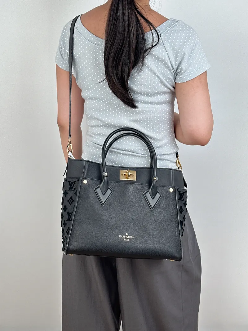 Louis Vuitton Top Handle Bag On My Side Black Calfskin Medium30.5 × 14 × 24.5 cm — on-model view 1 of 3