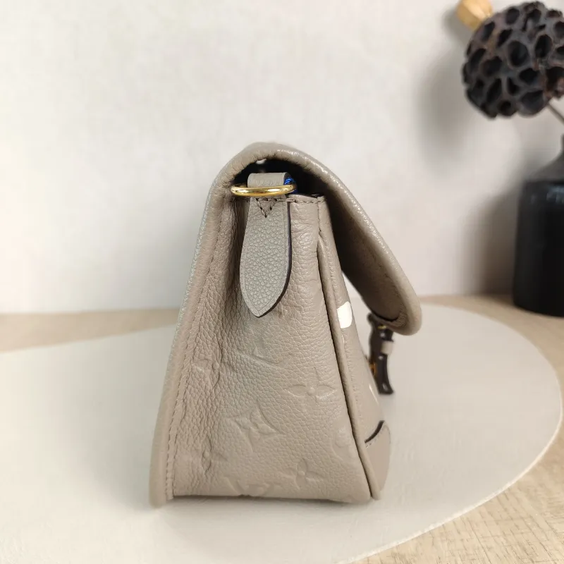 Louis Vuitton Crossbody Bag Diane Baguette Bag Monogram Empreinte Embossed Calfskin Small 24 × 9 × 15 cm — detail view 11 of 13