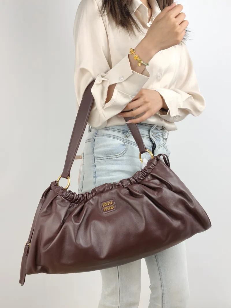 Miumiu Shoulder Bag Joie Shoulder Bag Lambskin Large 52 × 8 × 23 cm — on-model view 1 of 2
