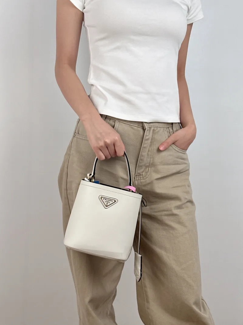 PRADA Shoulder Bag Panier White Calfskin Mini 16 × 10 × 17 cm — on-model view 1 of 3