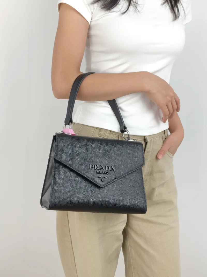 PRADA Shoulder Bag Shoulder Bag Black Calfskin One Size 24 × 12 × 17 cm — on-model view 2 of 3