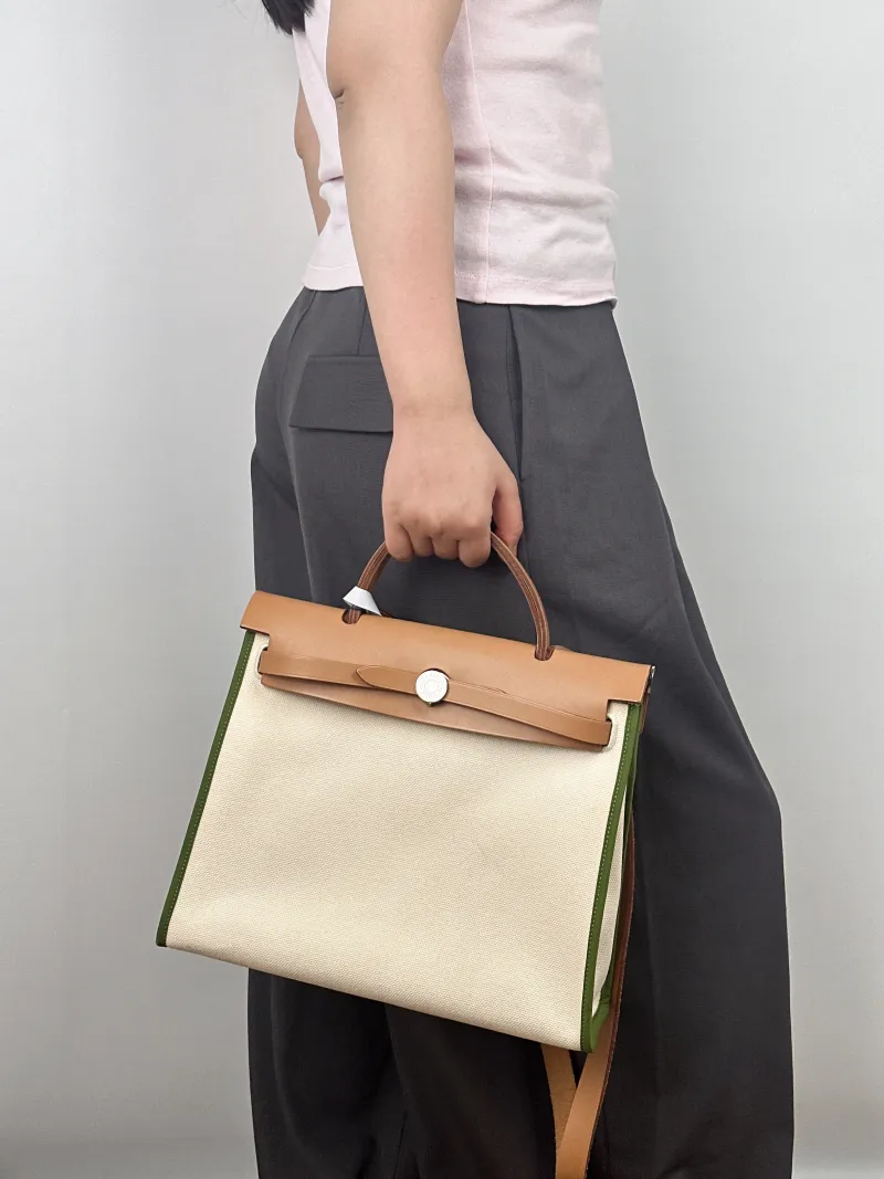 Hermès Crossbody Bag Herbag 31Green White Canvas Medium30.5 × 11 × 25.5 cm — on-model view 1 of 2
