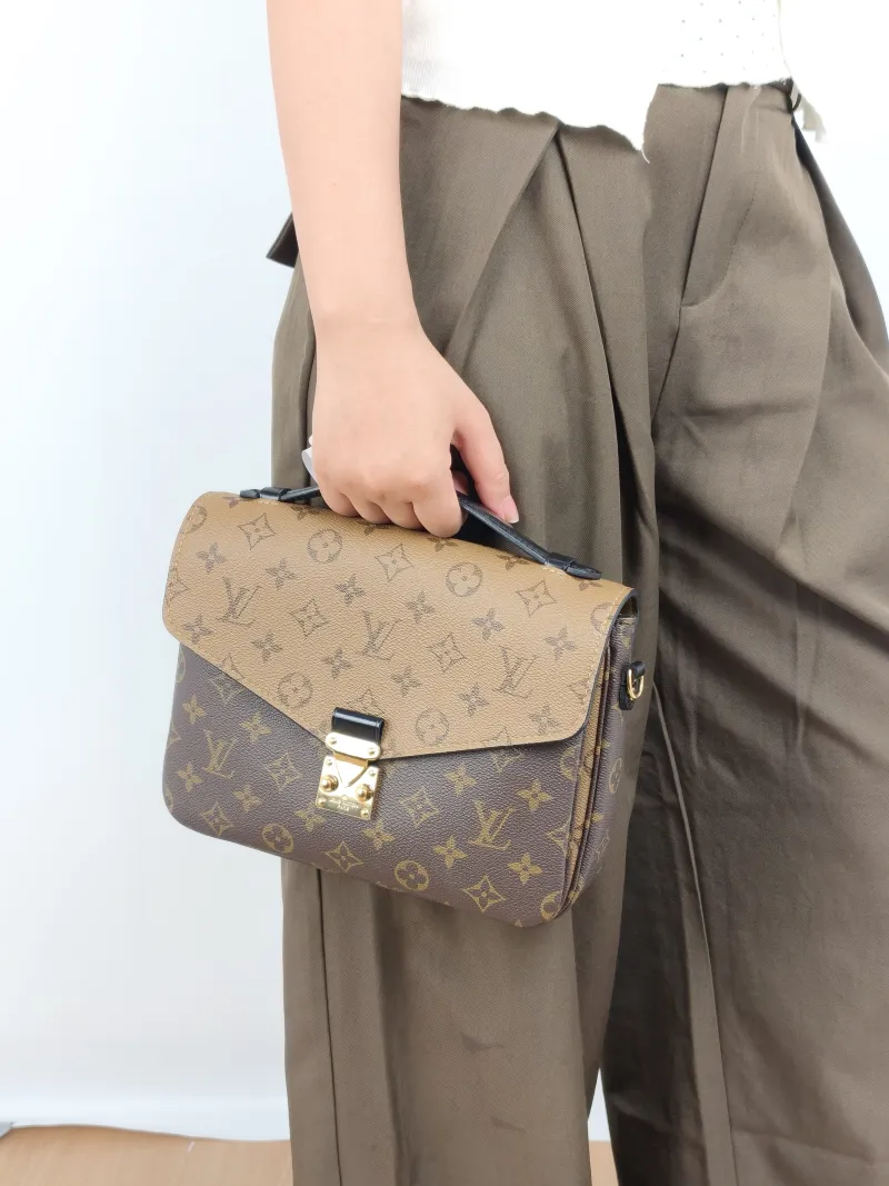 Louis Vuitton Crossbody Bag Pochette Métis Monogram Colorblock PVC Medium 25 × 7 × 19 cm — on-model view 3 of 3