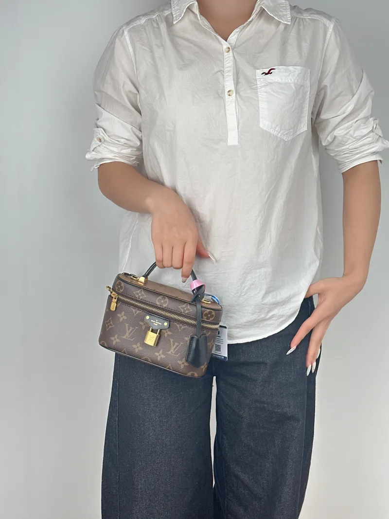 Louis Vuitton Shoulder Bag VANITY POUCH Cosmetic Bag Monogram PVC One Size19 × 6.5 × 11.5 cm — on-model view 1 of 3
