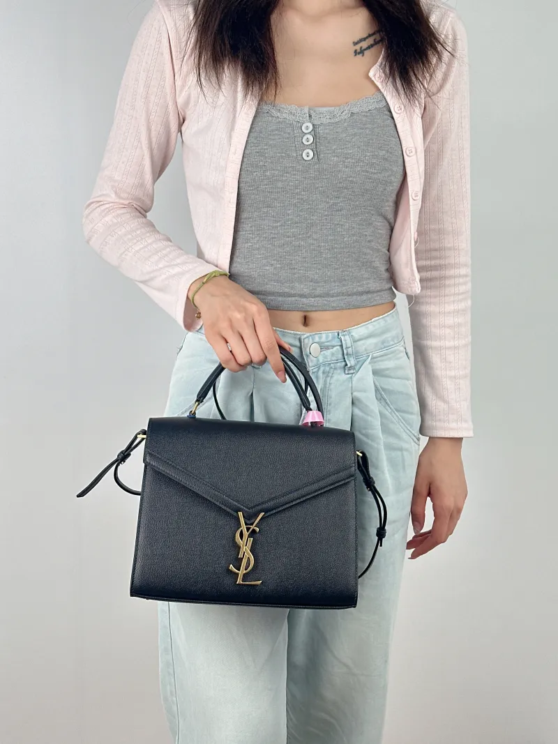 SAINT LAURENT Shoulder Bag Cassandra Shoulder Bag Black with Gold-Tone Hardware Grained Calfskin Medium 24.5 × 11.5 × 20 cm — on-model view 3 of 3