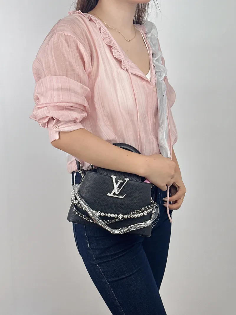 Louis Vuitton Shoulder Bag Capucines Black Calfskin Mini 21 × 8 × 14 cm — on-model view 2 of 2
