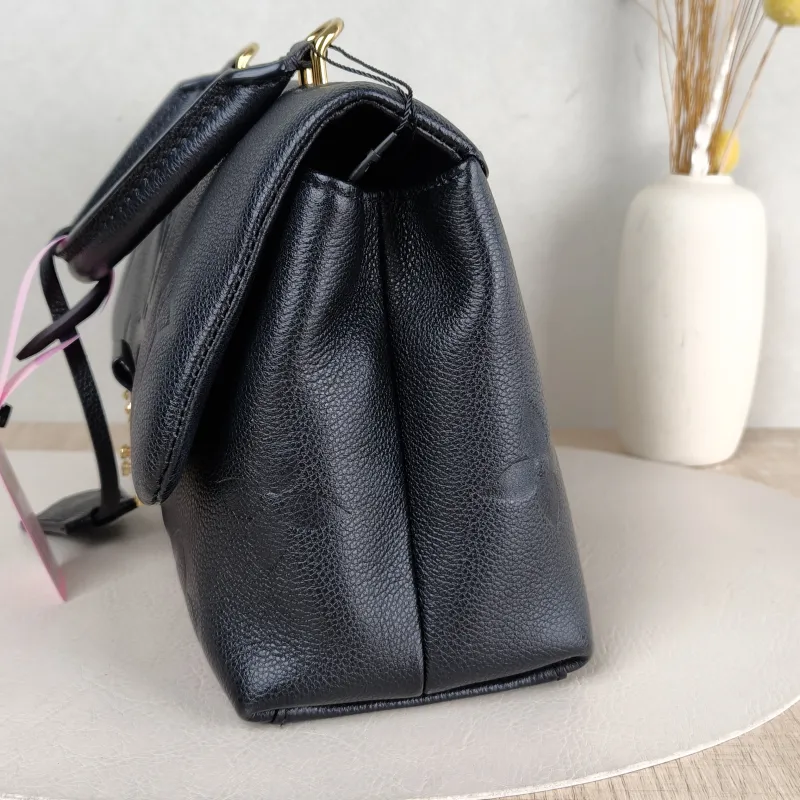 Louis Vuitton Crossbody Bag MADELEINE Black Monogram Empreinte Embossed Calfskin Medium 30 × 11 × 19.5 cm — detail view 10 of 13