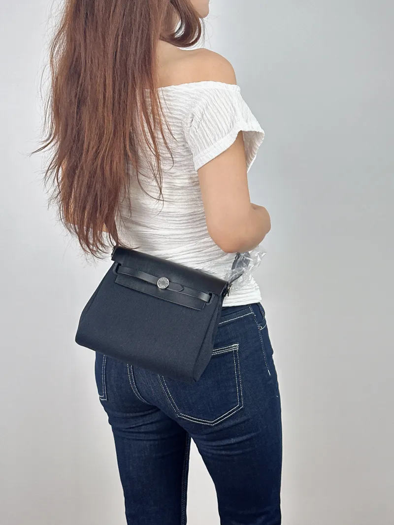 Hermès Crossbody Bag Herbag Zip 20 Black Canvas Mini 20.5 × 7 × 16.5 cm G — on-model view 1 of 2