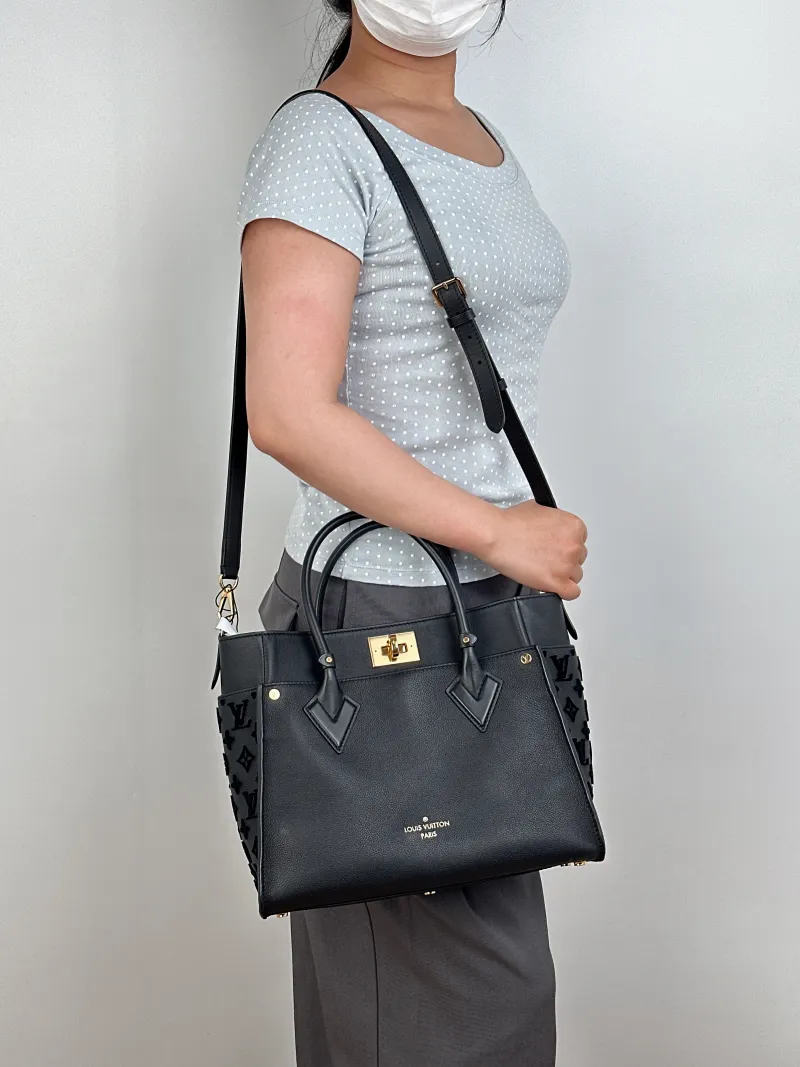 Louis Vuitton Top Handle Bag On My Side Black Calfskin Medium30.5 × 14 × 24.5 cm — on-model view 2 of 3