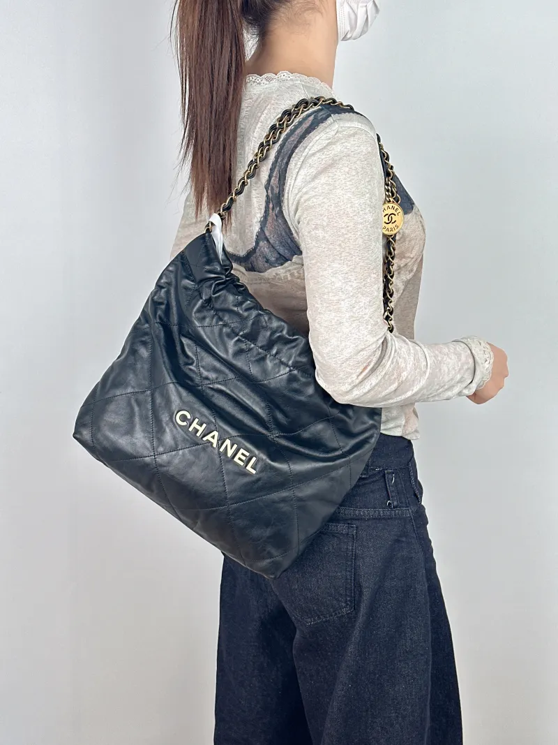 Chanel Shoulder Bag22Bag Black CC alfskin Small35 × 7 × 37 cm — on-model view 1 of 2