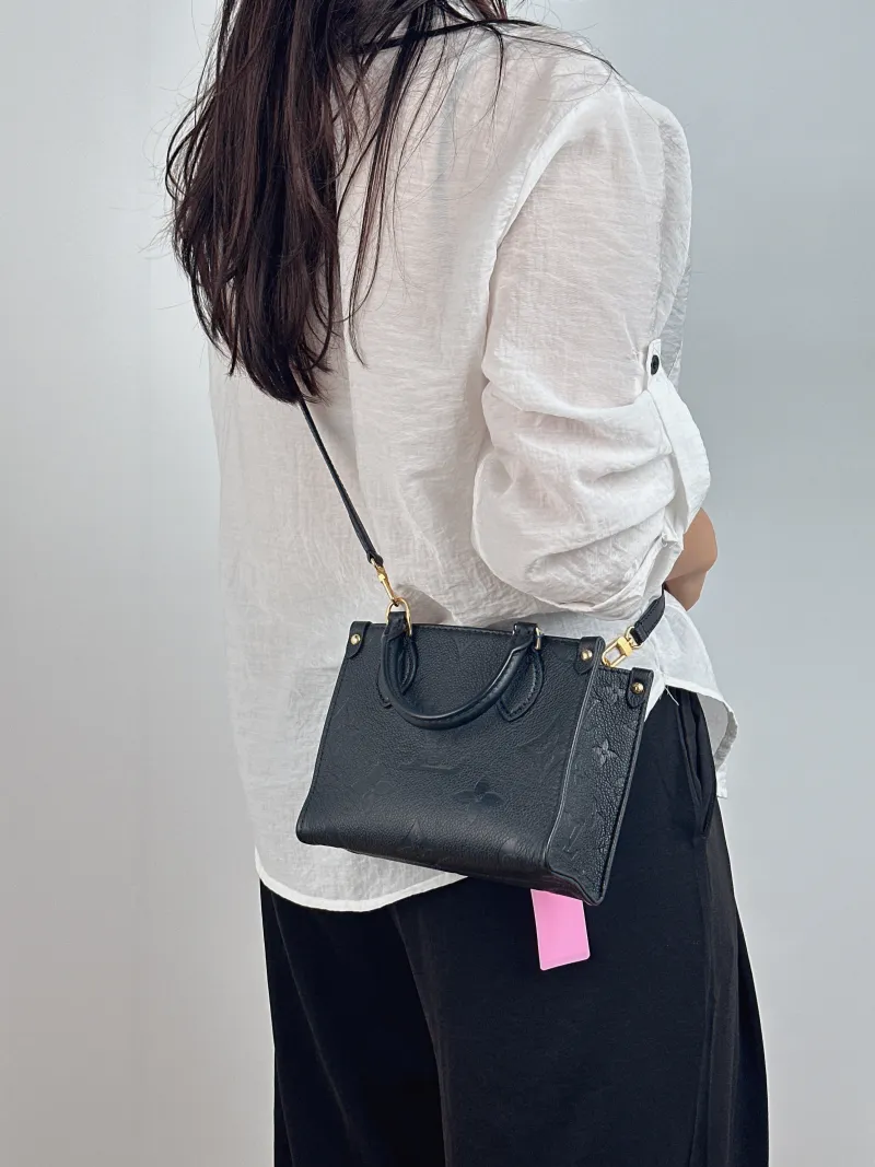 Louis Vuitton Crossbody Bag Onthego BB Black Empreinte Embossed Calfskin BB 18 × 8.5 × 15 cm — on-model view 1 of 2