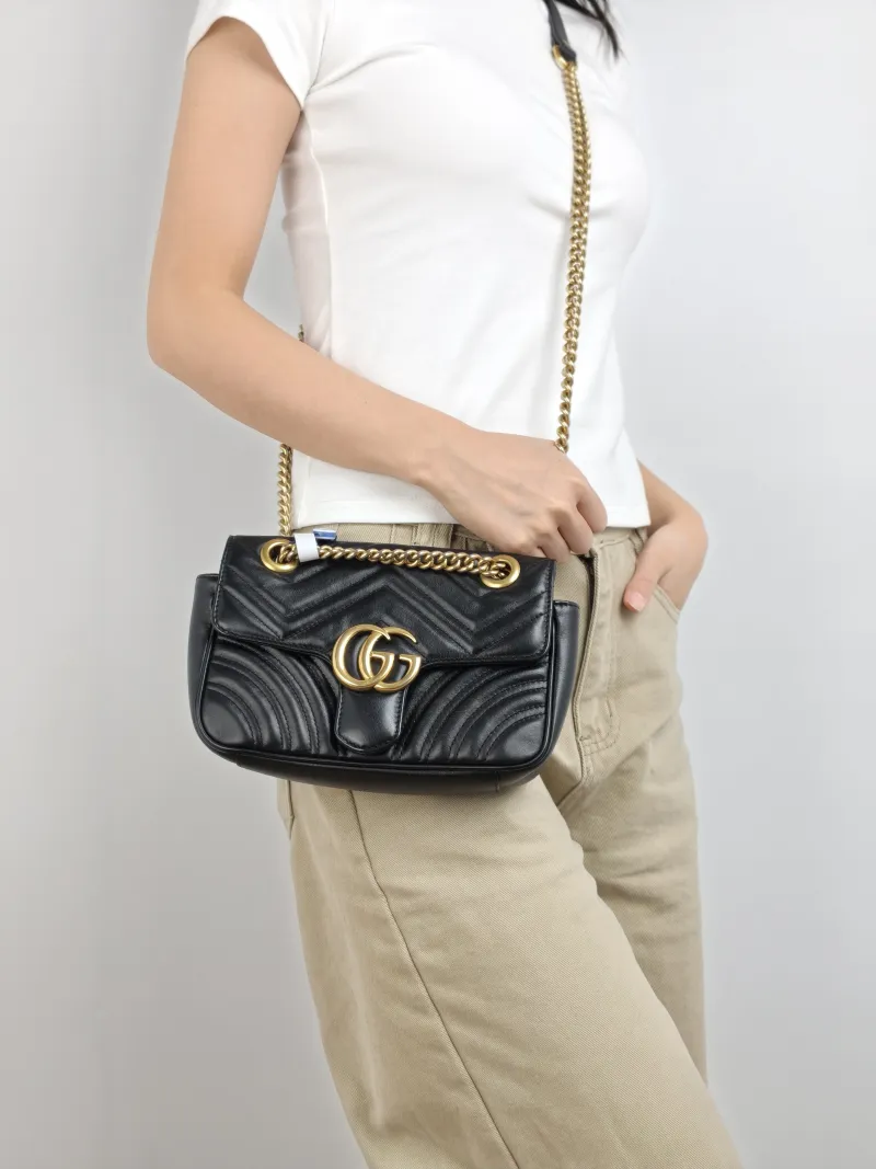 GUCCI Crossbody Bag GG Marmont Small Marmont 22 Black CC alfskin Small 22 × 6 × 13 cm — on-model view 1 of 2