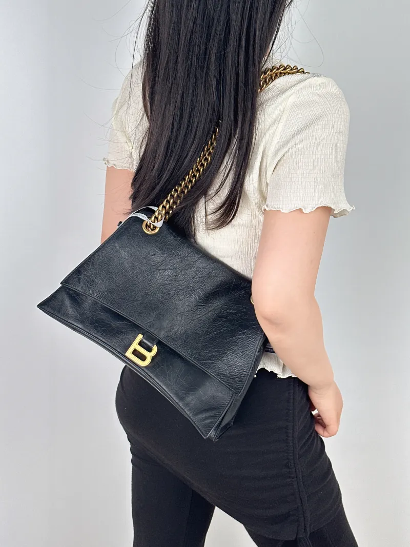 BALENCIAGA Shoulder Bag CRUSH Chain Bag Black CC alfskin Medium30 × 13 × 20 cm — on-model view 1 of 2