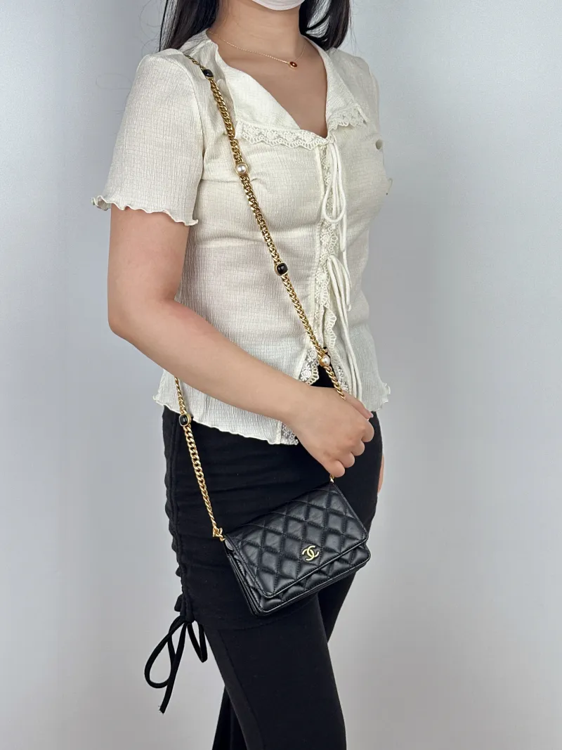 Chanel Crossbody Bag woc Black Lambskin One Size15.5 × 5 × 11 cm — on-model view 2 of 2