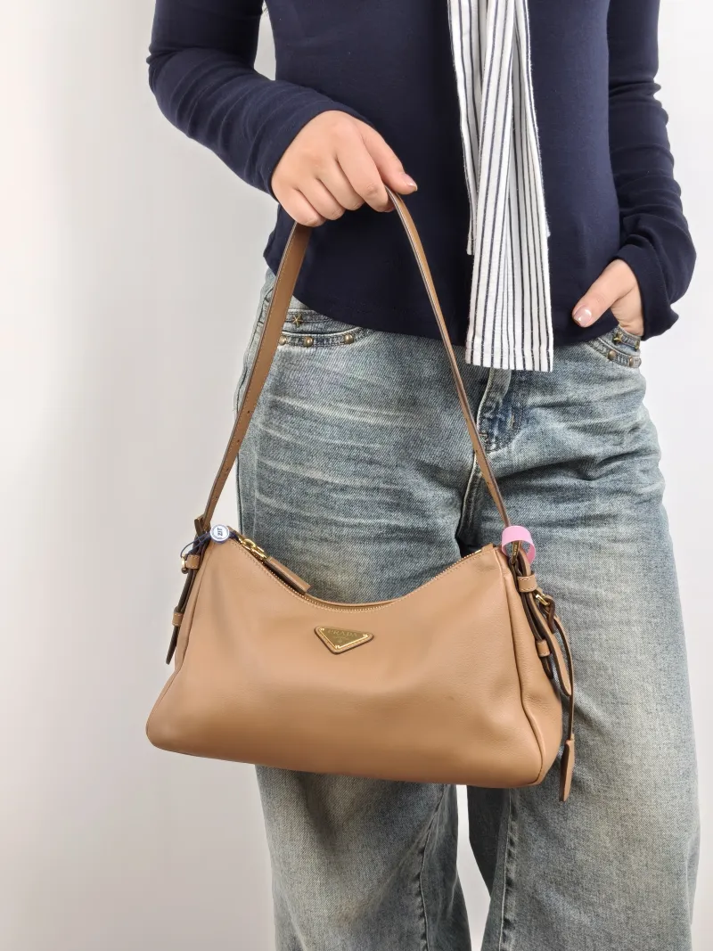 PRADA Shoulder Bag Aimée Brown Calfskin 31 × 9.5 × 18 cm — on-model view 1 of 2