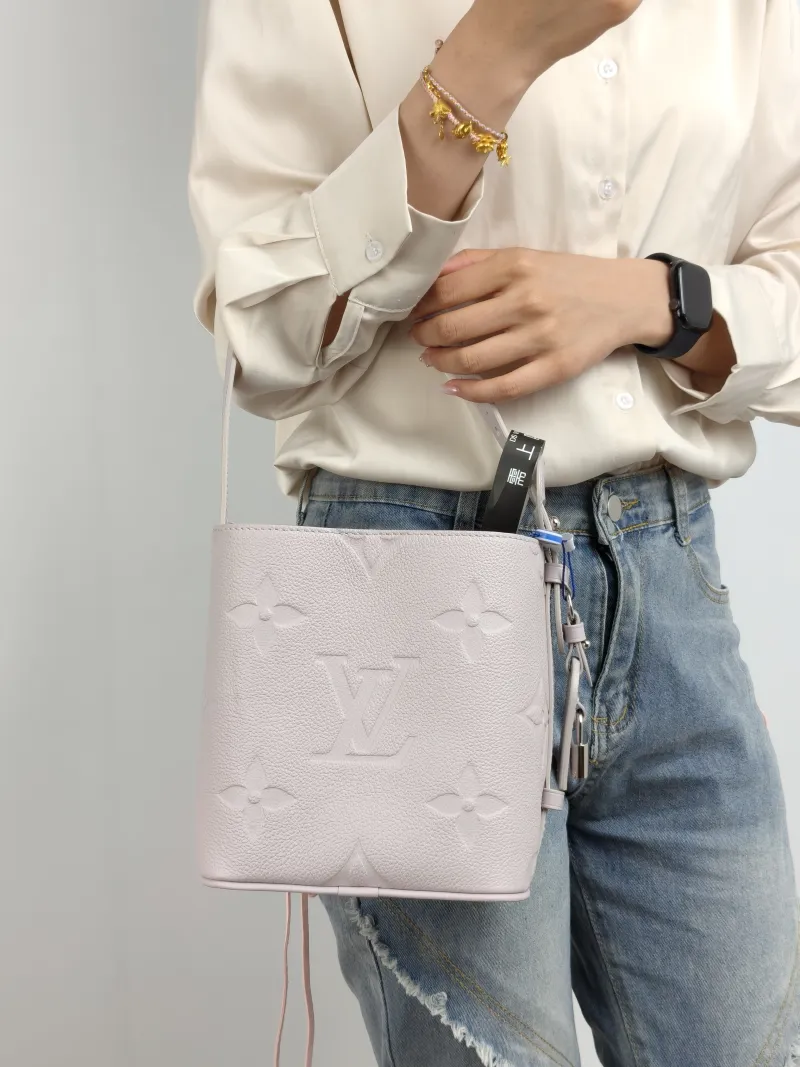 Louis Vuitton Top Handle Bag ALL IN BB Grey Calfskin BB 16 × 12 × 18 cm — on-model view 1 of 3