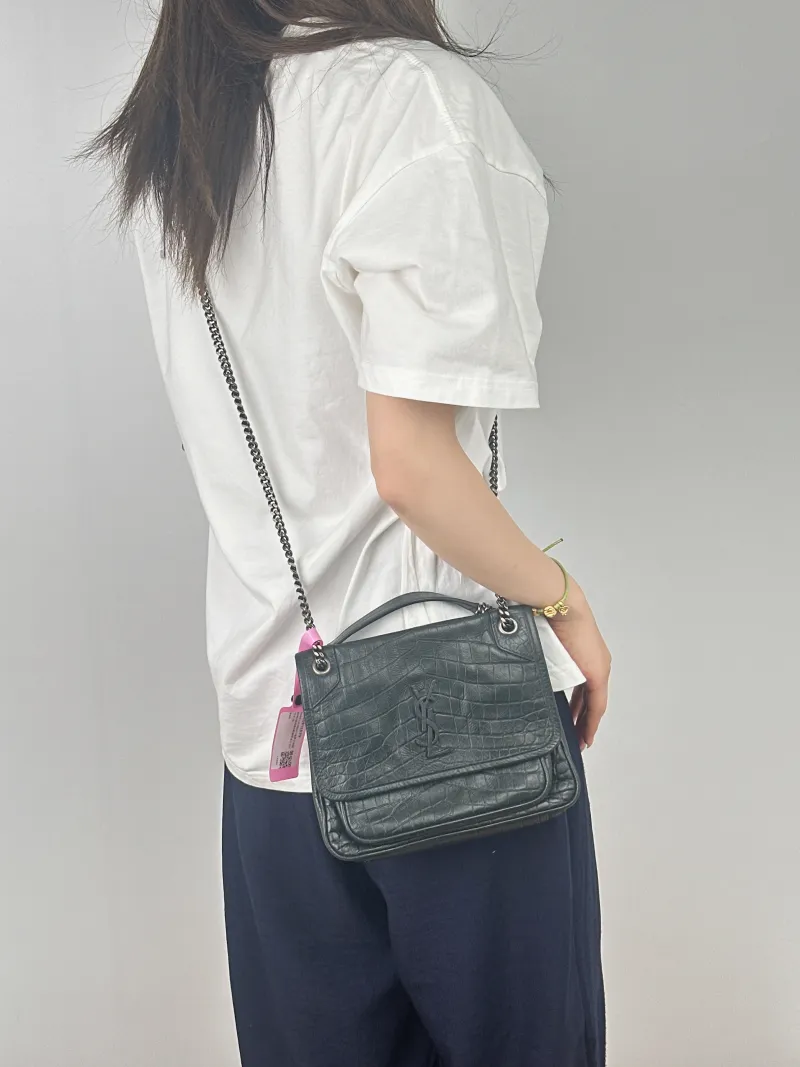 SAINT LAURENT Crossbody Bag Niki Green D Waxed Leather Small21 × 7.5 × 16 cm — on-model view 2 of 2