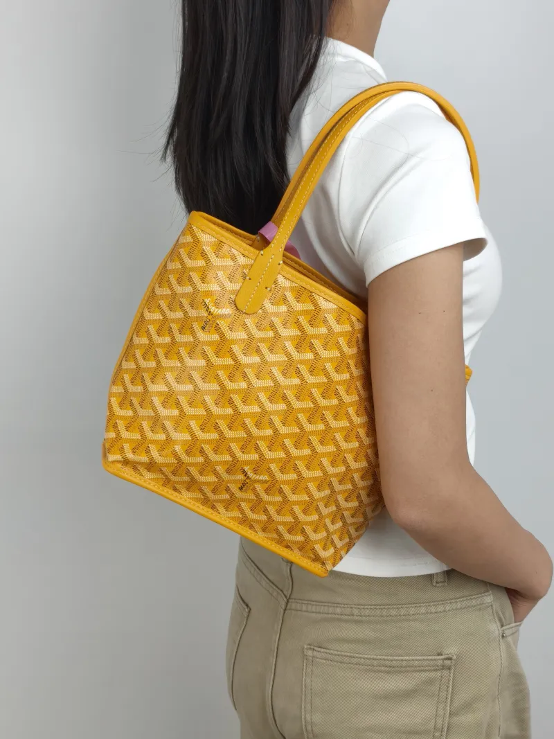 GOYARD Top Handle Bag ANJOU Shopping Tote Yellow PVC Mini 19.5 × 9 × 19.5 cm — on-model view 3 of 3