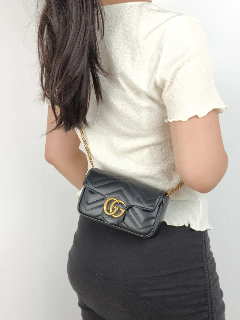 GUCCI Crossbody Bag GG Marmont Mini Marmont Mini Black Calfskin Mini 16.5 × 4.5 × 9.5 cm — on-model view 2 of 2