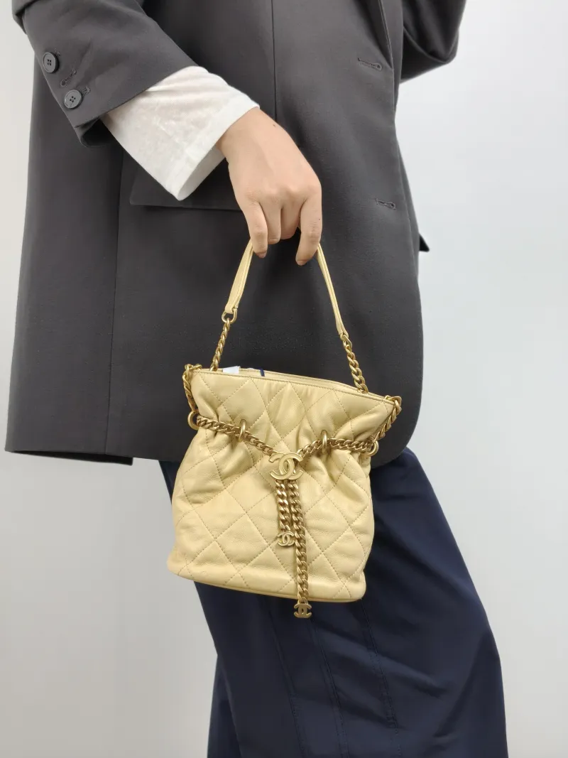 Chanel Shoulder Bag Bucket Bag Yellow Lambskin One Size 17 × 10 × 18.5 cm — on-model view 2 of 2