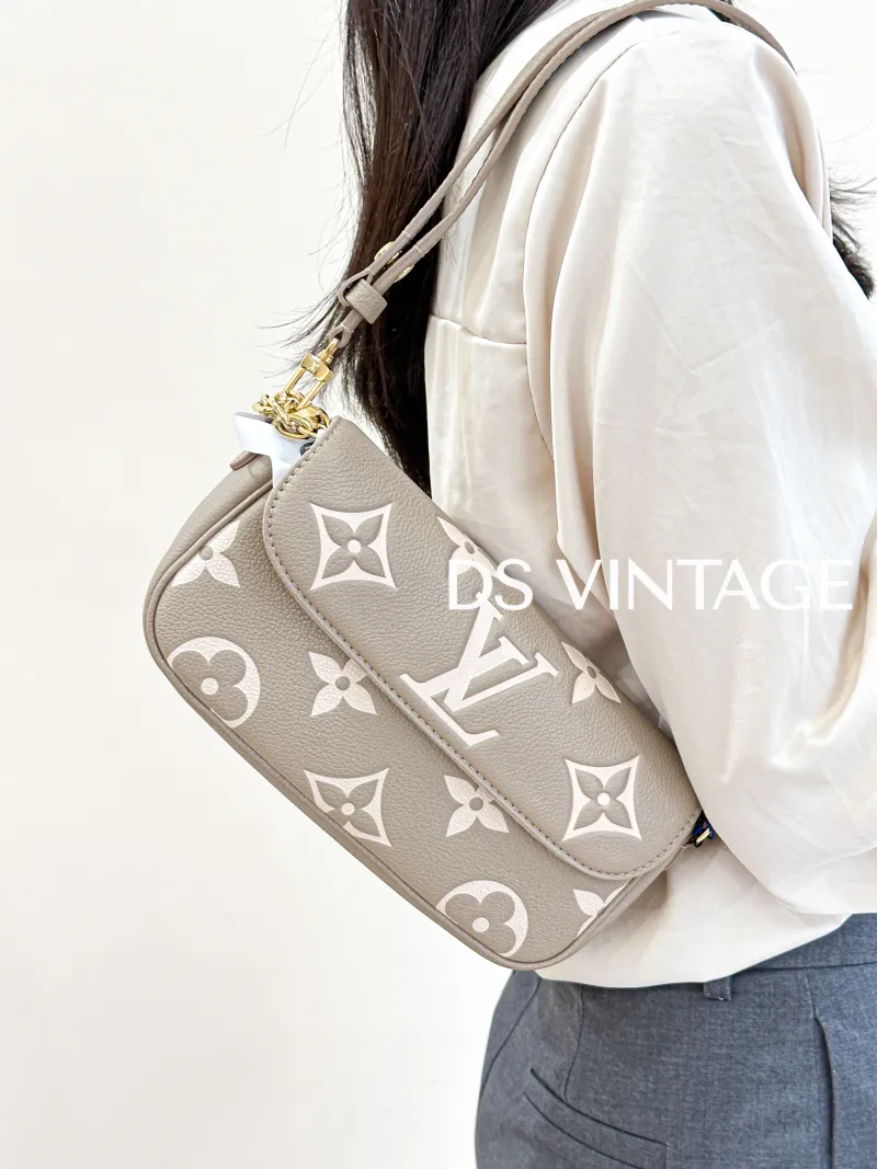 Louis Vuitton Crossbody Bag IVY Empreinte Embossed Calfskin Small 23.5 × 4.3 × 12 cm — on-model view 1 of 3