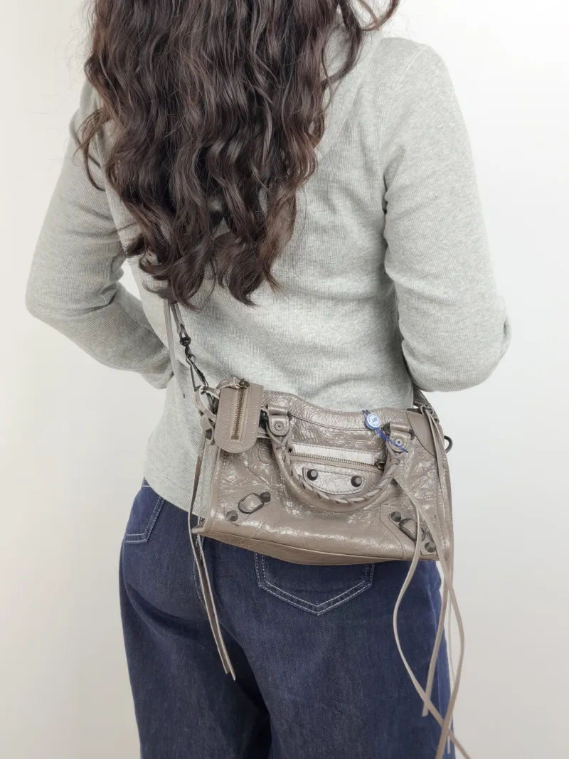 BALENCIAGA Crossbody Bag Classic City Brown Lambskin Mini 24 × 10 × 16 cm — on-model view 2 of 3