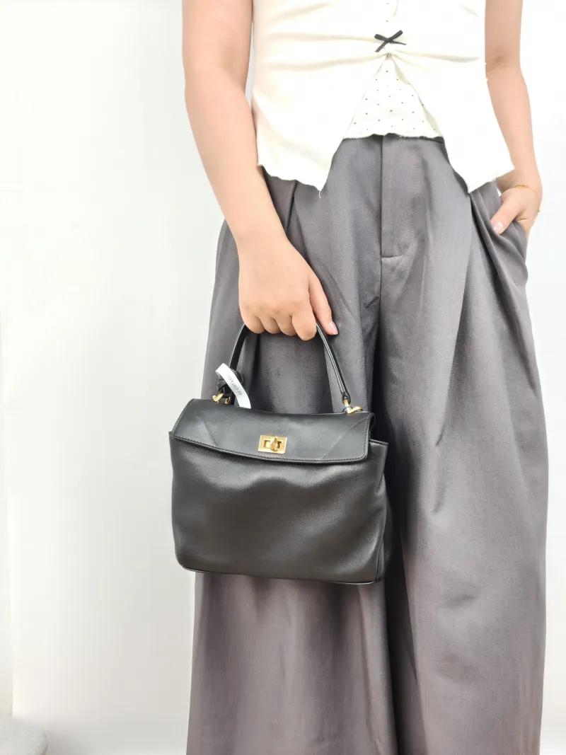 BALENCIAGA Crossbody Bag RODEO Black CC alfskin Mini 23 × 10 × 17 cm — on-model view 1 of 3