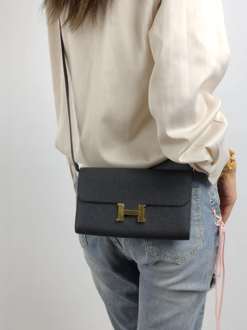 Hermès Crossbody Bag Constance To Go woc Gold-Tone Hardware Black Epsom Embossed Calfskin One Size 21 × 2 × 13 cm W — on-model view 1 of 2