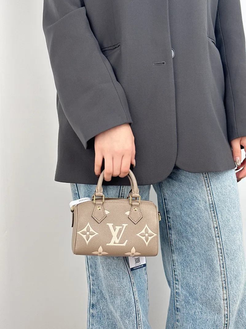 Louis Vuitton Crossbody Bag Speedy Nano · White Monogram Empreinte Embossed Calfskin nano 16 × 7.5 × 10 cm — on-model view 2 of 3