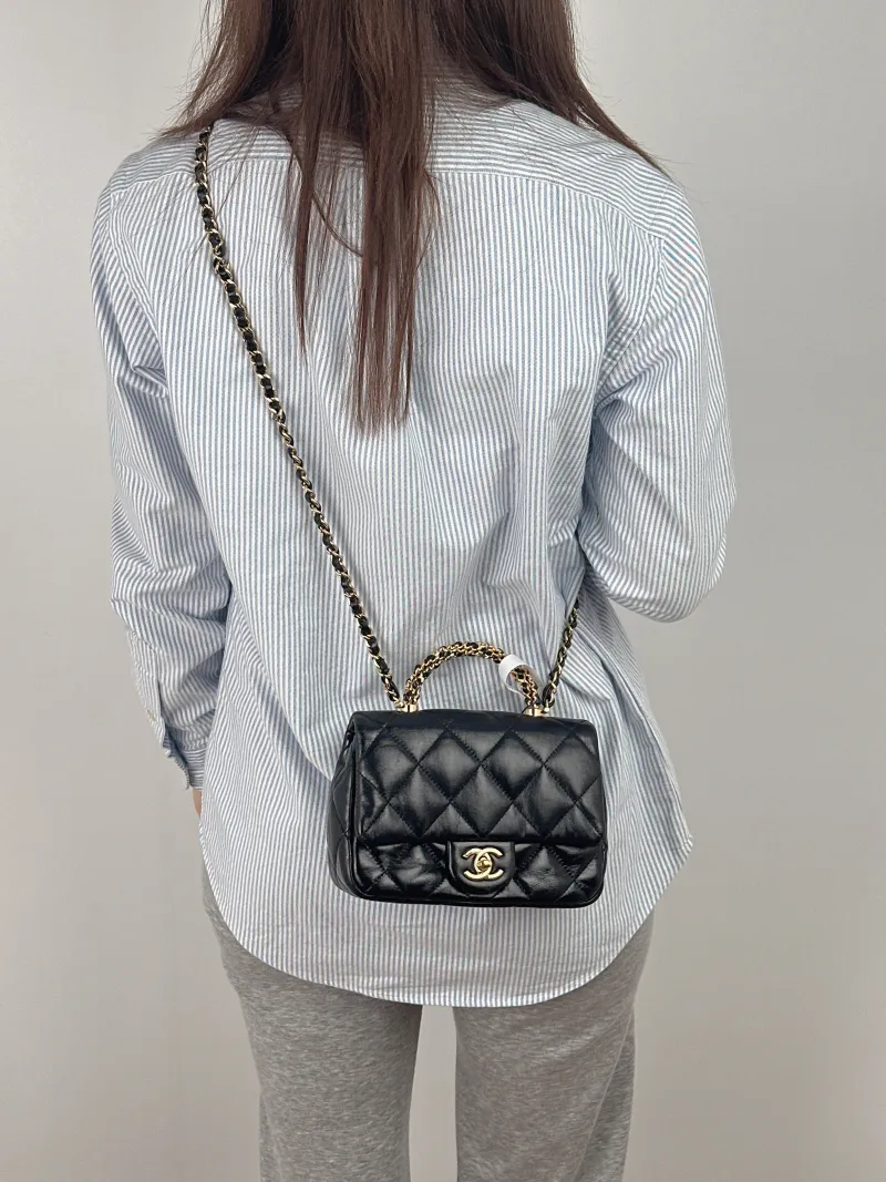 Chanel Crossbody Bag 24b Black Lambskin Mini 19 × 8.5 × 14 cm — on-model view 2 of 3