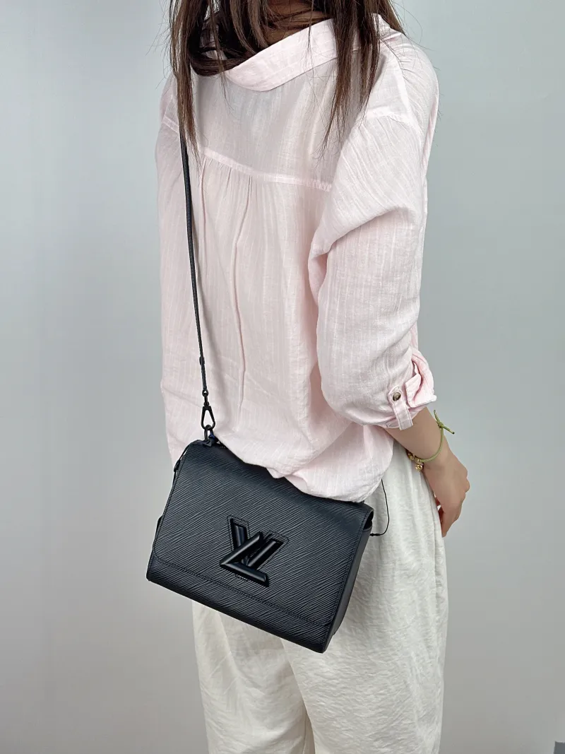 Louis Vuitton Crossbody Bag Twist Black Epi Embossed Calfskin Medium23 × 9.5 × 17 cm — on-model view 3 of 3