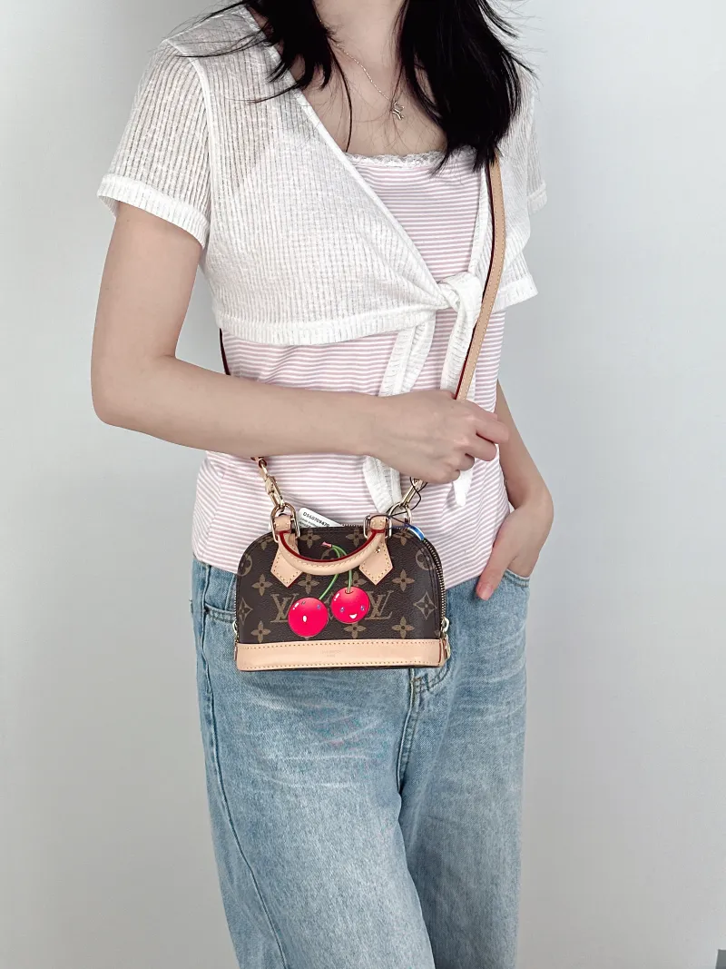 Louis Vuitton Crossbody Bag Alma Nano Monogram · PV Cnano18 × 8 × 12 cm — on-model view 2 of 3