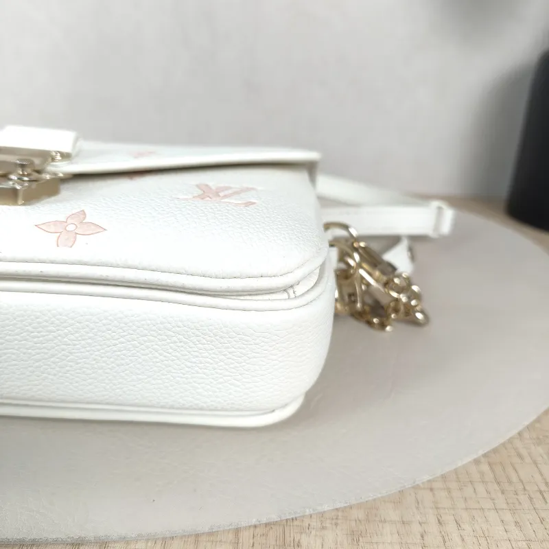 Louis Vuitton Crossbody Bag Pochette Métis East West White · Pink Monogram Empreinte Embossed Calfskin Small21.5 × 6 × 13.5 cm — detail view 12 of 13