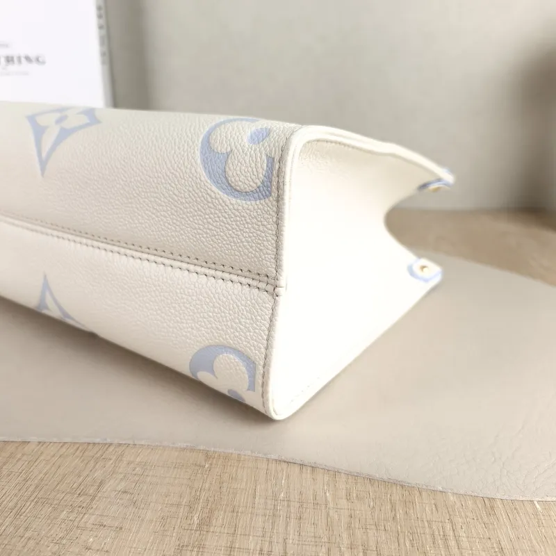 Louis Vuitton Shoulder Bag Onthego White · Blue Monogram Empreinte Embossed Calfskin Small 25 × 11.5 × 19 cm — detail view 9 of 11