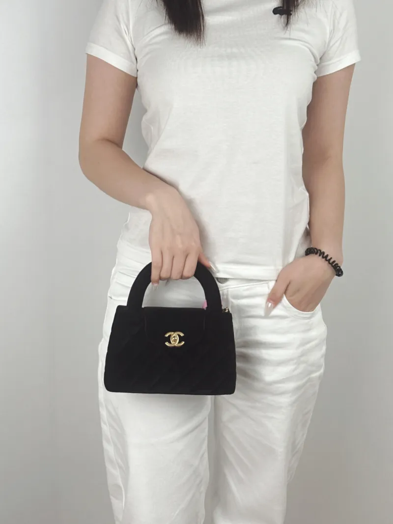 Chanel Crossbody Bag Kelly Black Velvetmini19 × 7 × 13 cm — on-model view 1 of 3