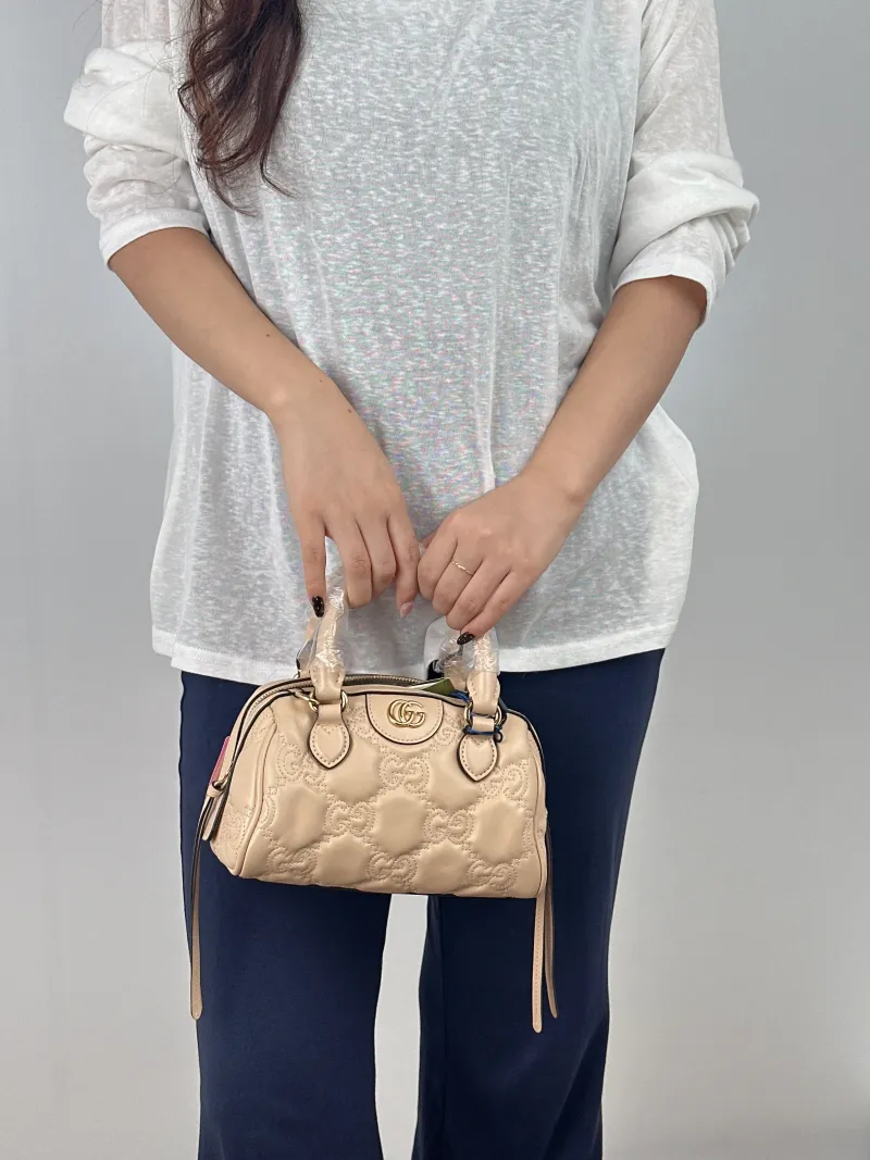 GUCCI Crossbody Bag GG matelasse Taupe Calfskin Mini 19 × 11 × 13 cm — on-model view 1 of 2